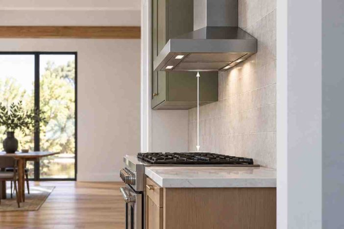 Range hood height above stove showing vertical clearance measurement between the cooking surface and wall-mounted range hood